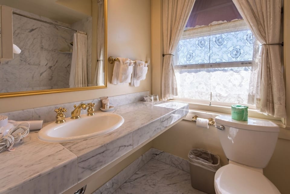 Get ready comfortably with a bright vanity and generous counter space.