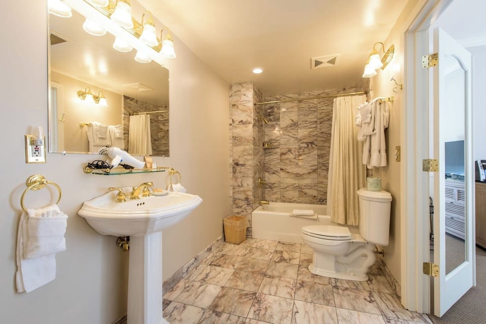 Indulge in a spacious marble bath with hotel-style amenities.