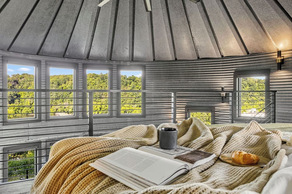 Cozy loft retreat with treetop views, natural light, and a peaceful vibe