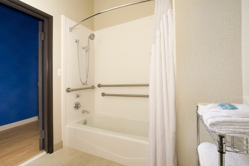 Rinse off easily with a roomy tub-shower and safety rails.