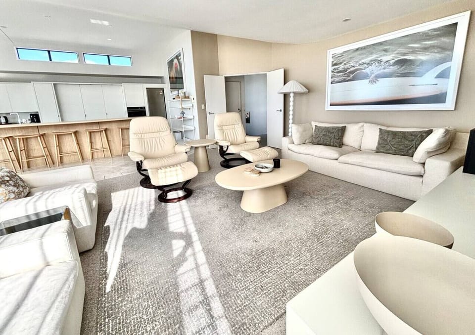 Open Plan Living/Dining out onto upstairs balcony with outdoor dining table and chairs
