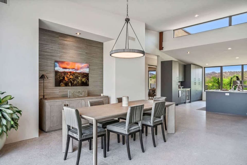 Estate 1 - Formal dining area offering a table to accommodate 6 guests.