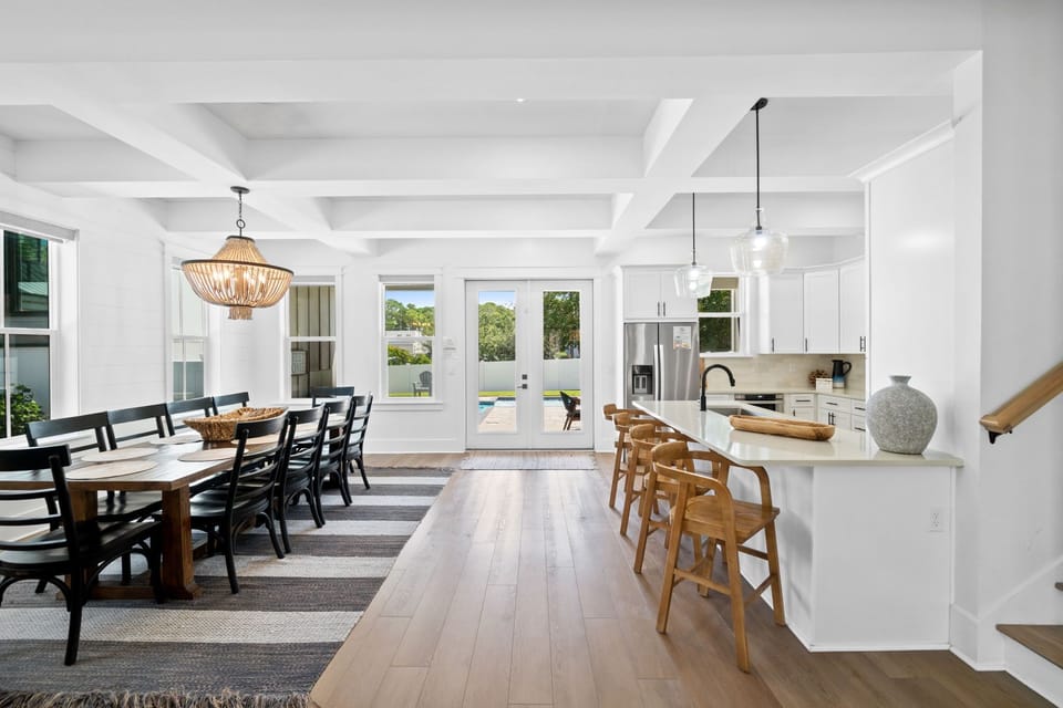 Kitchen and dining flow seamlessly with seating for all.