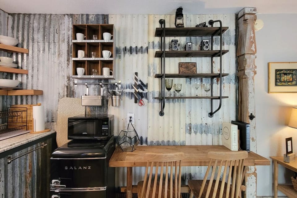 mini fridge with freezer, microwave, 2 person dining area