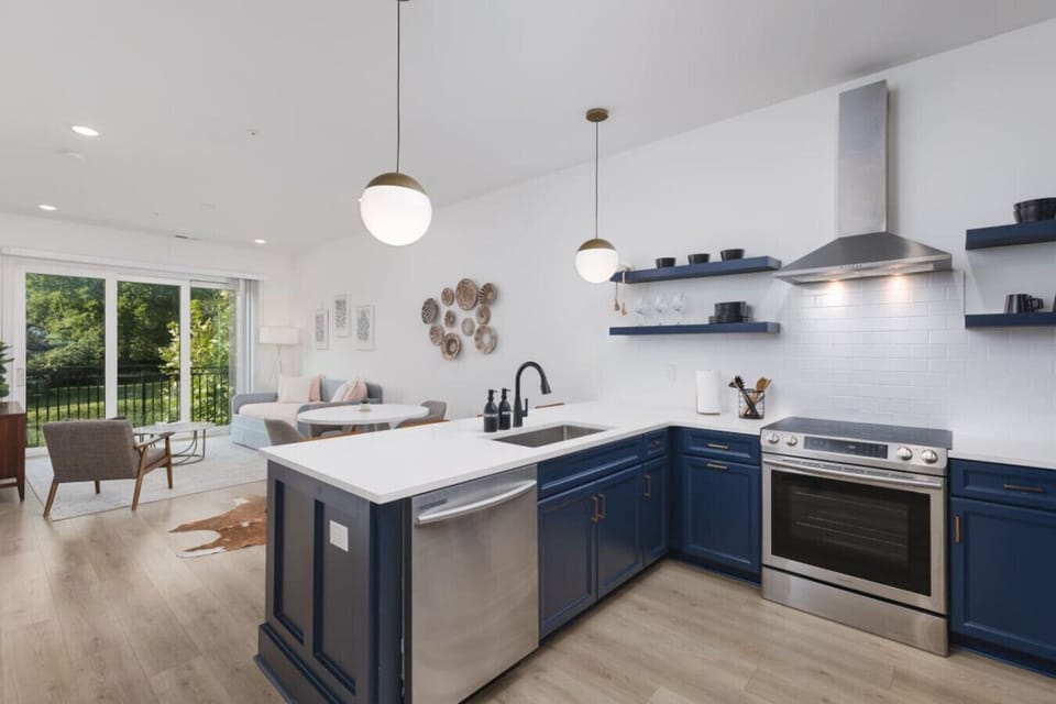 Condo 1 - Open floor plan with lots of natural light. Fully-stocked kitchen with all the appliances, spices, dishware & utensils you'd need for a great meal.