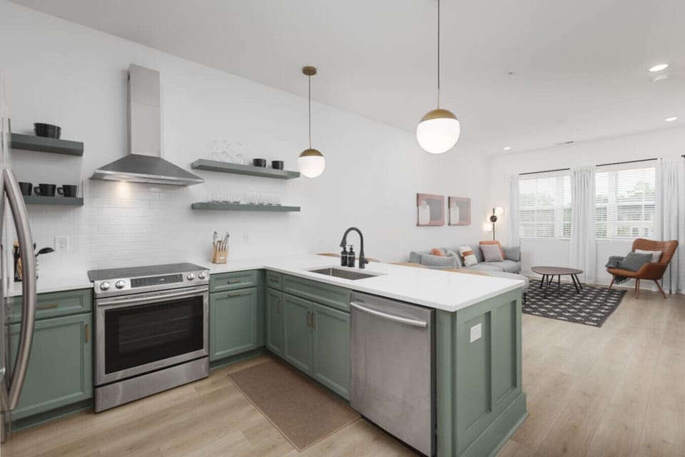 Condo 1 - Open floor plan with lots of natural light and seating for 4 at the kitchen counter.