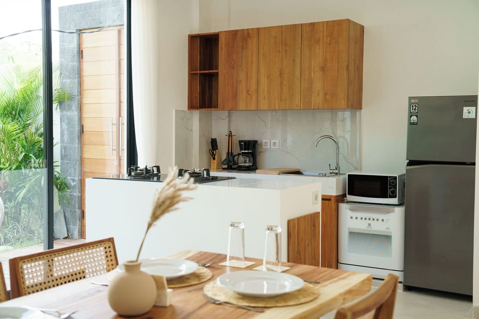 Deluxe Villa, Pool View | Private kitchen | Full-size fridge, stovetop, electric kettle, cookware/dishes/utensils