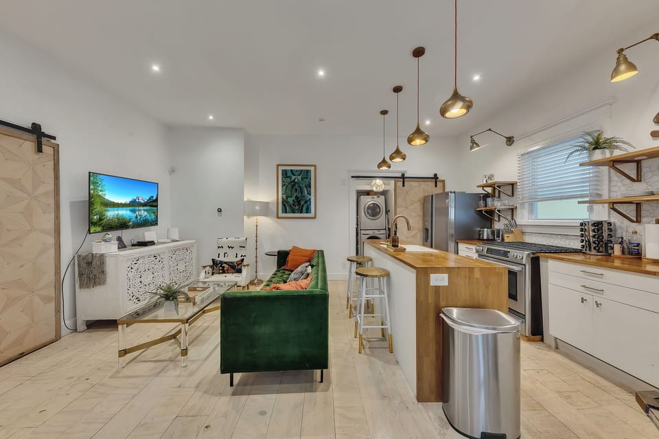 Spacious layout connecting living room & kitchen island, perfect for gathering