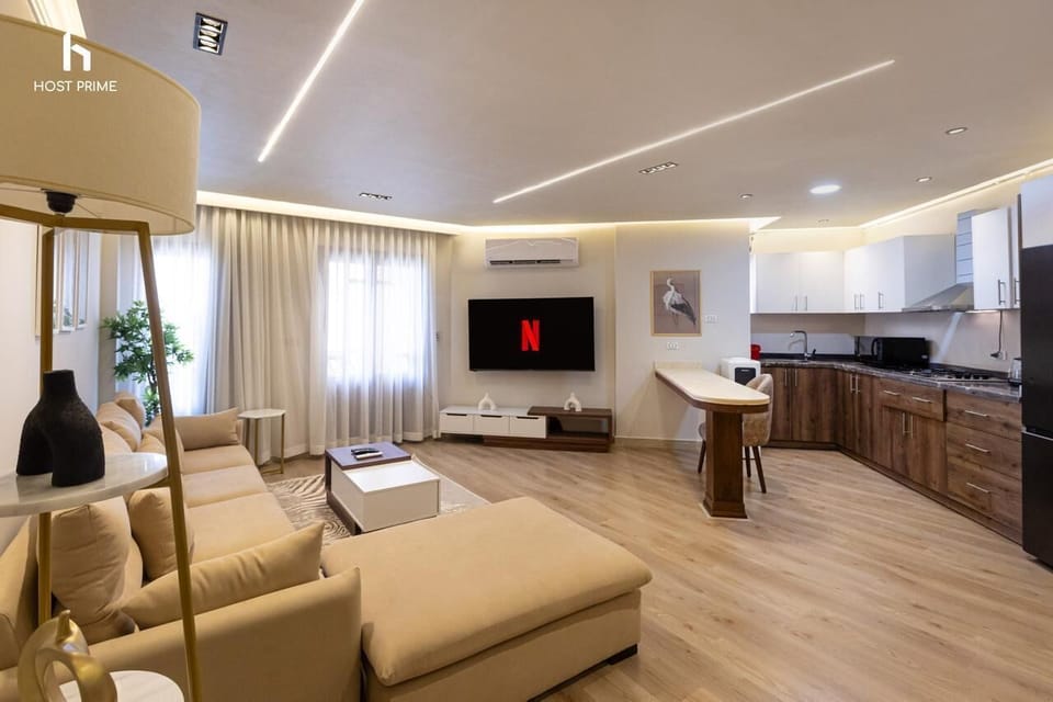 Apartment, Air conditioning, Garden View | Living area | 55-inch LCD TV with satellite channels