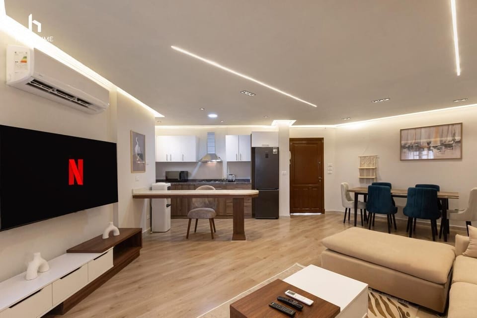 Apartment, Air conditioning, Garden View | Living area | 55-inch LCD TV with satellite channels
