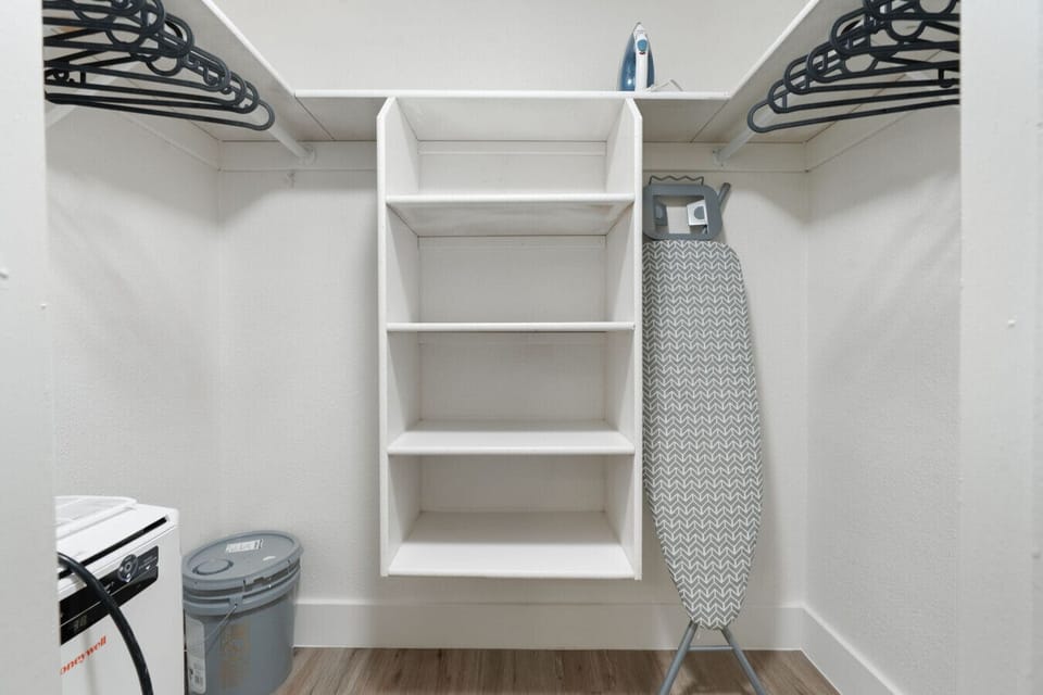 Spacious walk-in closet with ironing board included.