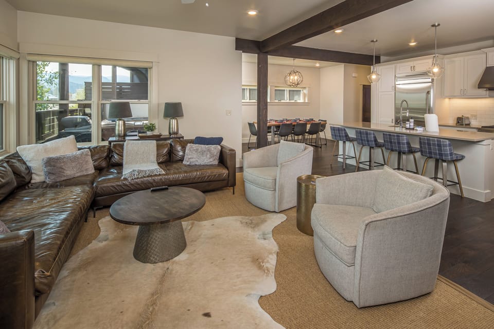 Cozy leather couch with plush chairs for all the be comfortable | main Level