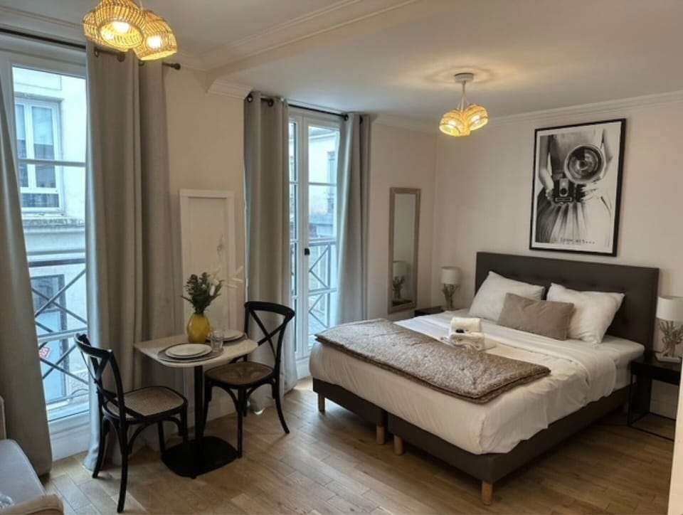 Apartment | Laptop workspace, iron/ironing board, bed sheets