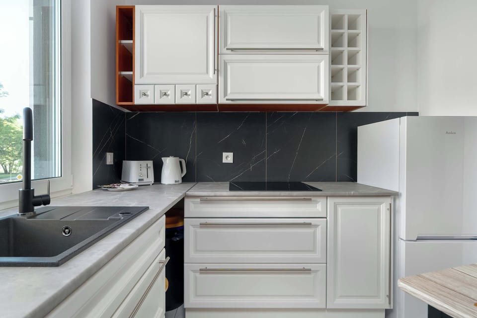 The kitchen offers a functional layout for convenient cooking.