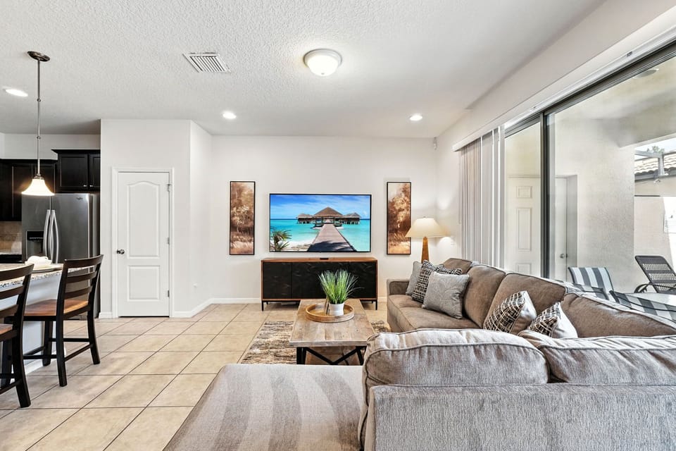 Kick back on the comfy sectional and enjoy your favorite shows in this bright, open living area!