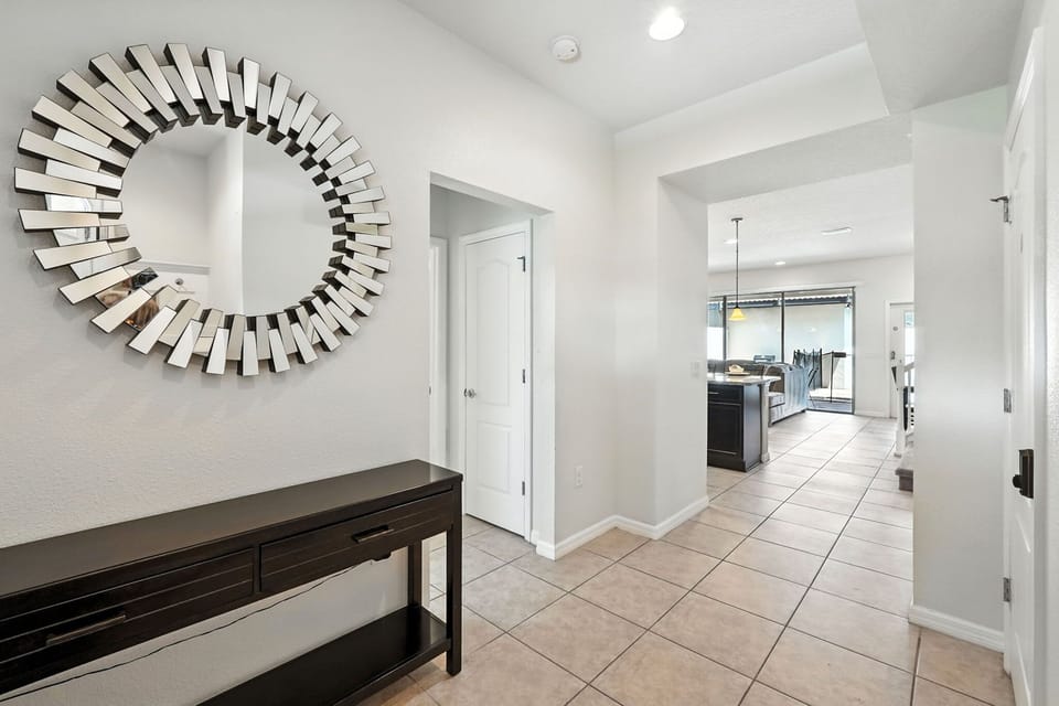 Bright, inviting entryway with sleek modern touches and seamless flow into the heart of the home!