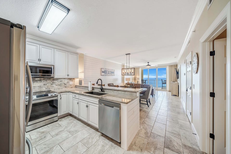 The beautifully updated and fully equipped kitchen features granite countertops, stainless-steel appliances, and has everything you need to prepare meals for family & friends.