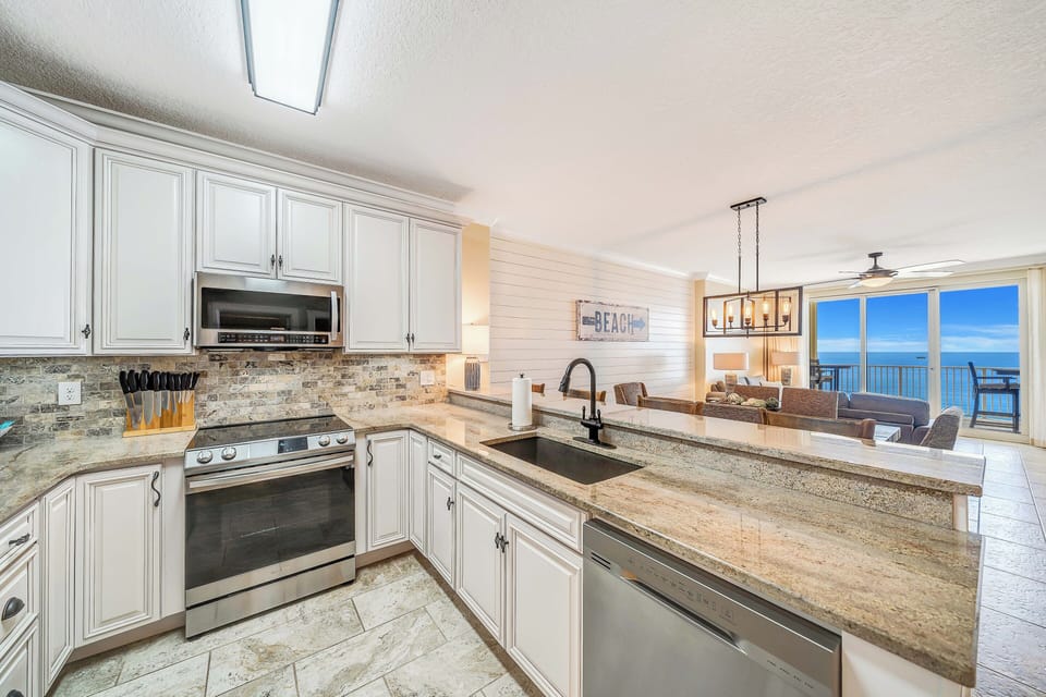 The beautifully updated and fully equipped kitchen features granite countertops, stainless-steel appliances, and has everything you need to prepare meals for family & friends.