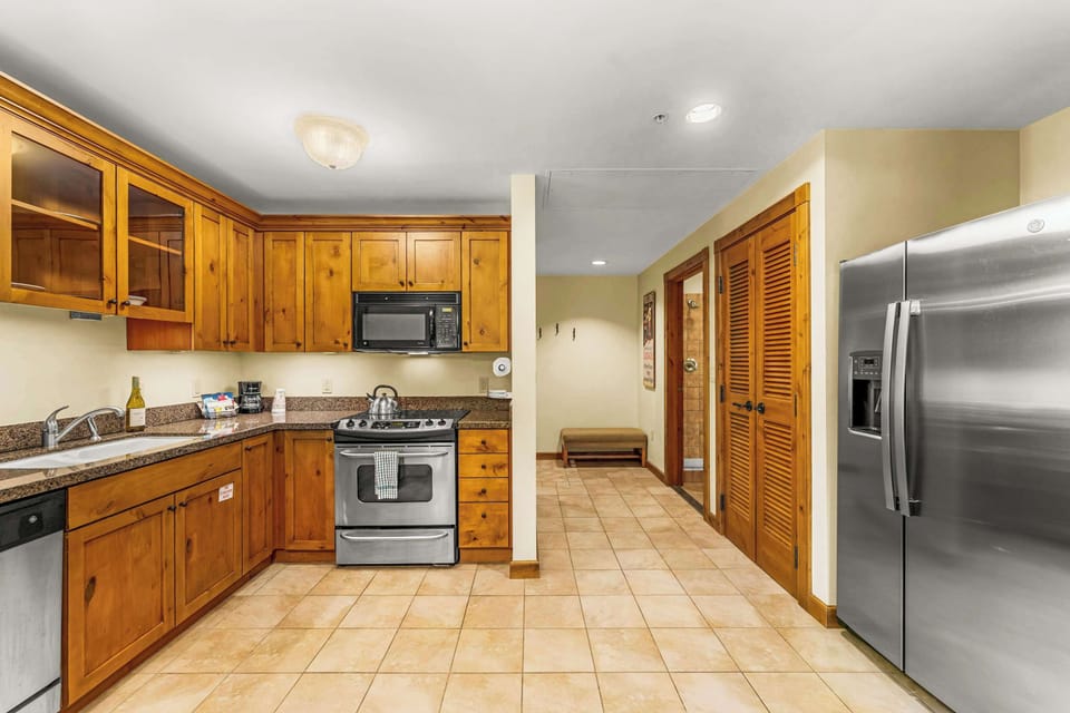 A cozy, well-equipped kitchen for cooking and enjoying meals. | Listed with @BookTraverse