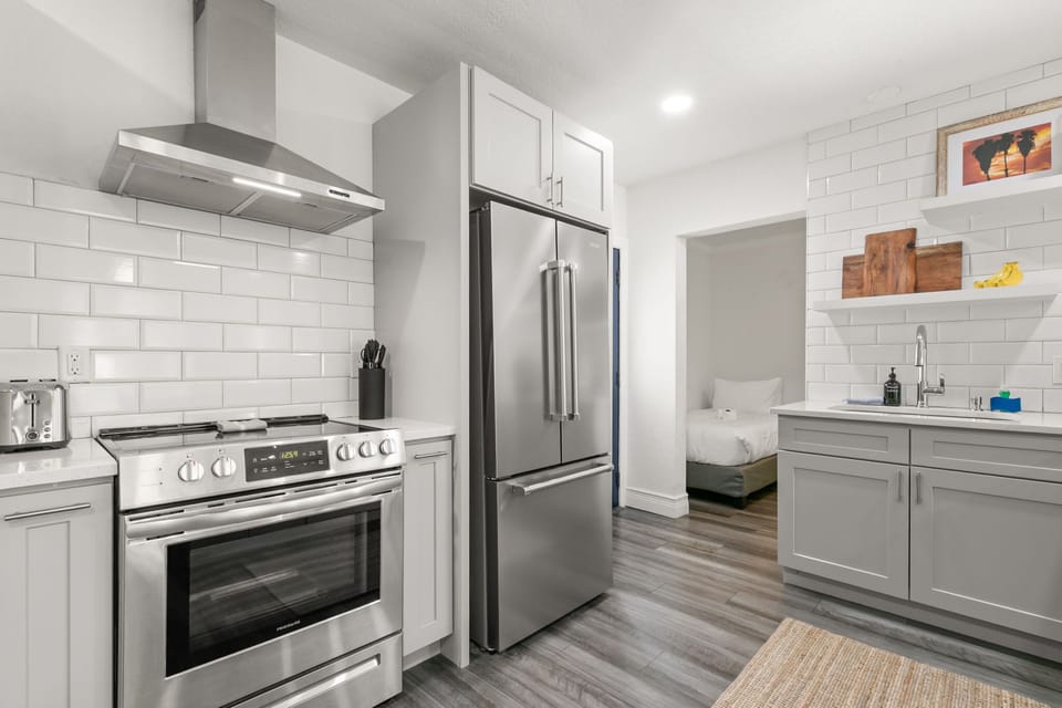 Modern kitchen with stainless steel appliances and sleek finishes