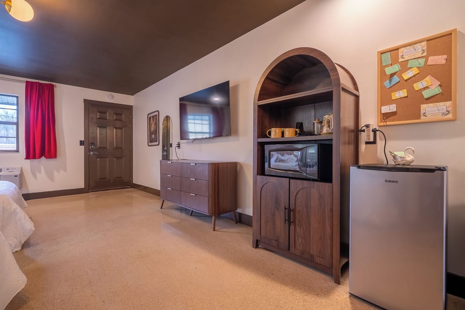 Smart TV, dresser, microwave, hot water kettle, french press, local coffee and tea, mini fridge
