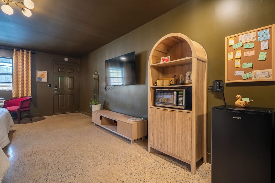 Microwave, mini fridge, french press, hot water kettle, local coffee and tea.