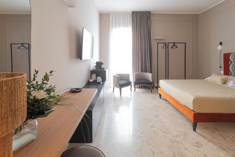 Deluxe Triple Room, Balcony, Courtyard View | Desk, iron/ironing board, free WiFi