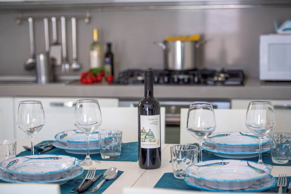 Set with beautiful ceramic plates, stylish cutlery, and wine glasses