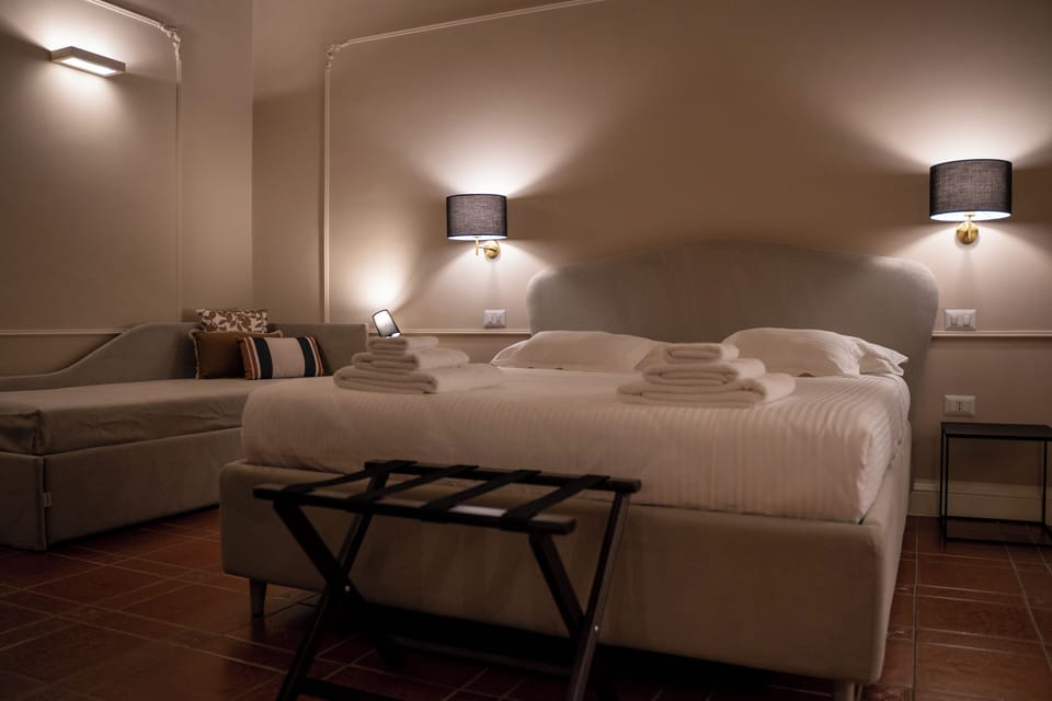 Comfort Triple Room, Courtyard View | Blackout drapes, iron/ironing board, free WiFi