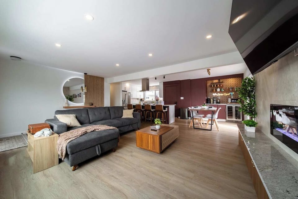 Unwind in this spacious and beautifully styled open-concept living area. From cozy movie nights to wine and chats by the fireplace, this space is made for comfort and connection.
