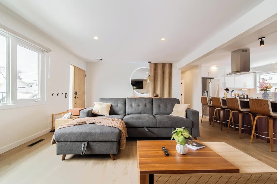Curl up with a book or stream your favorite show in this cozy living space featuring a stylish electric fireplace and plush sectional.