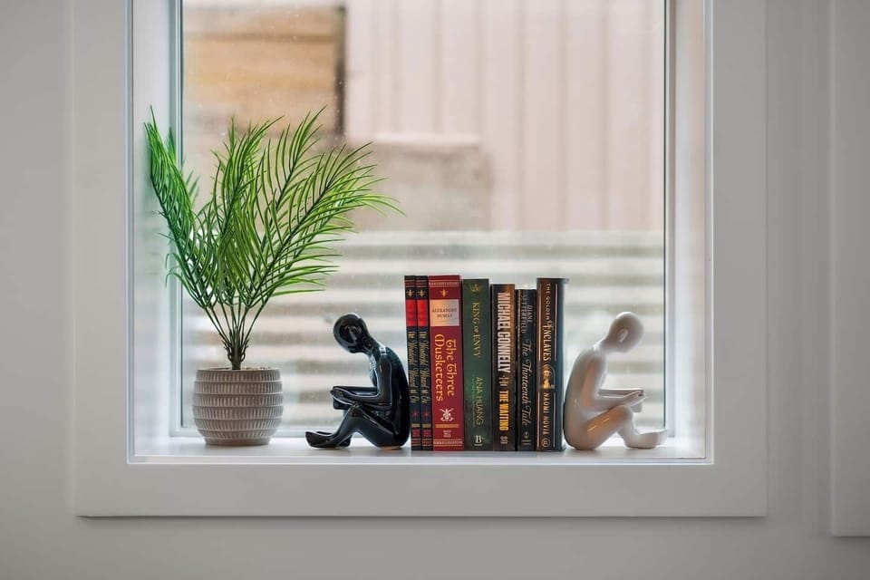 A quiet corner for the curious mind. Enjoy a curated mini library, peaceful views, and a touch of greenery to inspire slow mornings and relaxing afternoons.