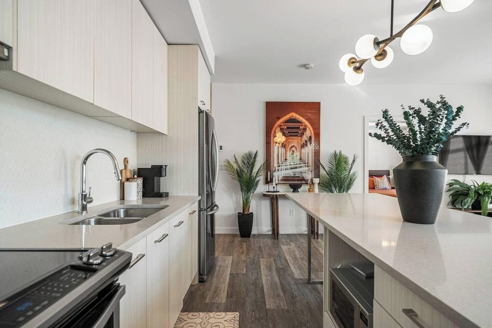 Modern kitchen with sleek countertops, stainless steel appliances, and thoughtful details perfectly blending style and functionality for your stay.