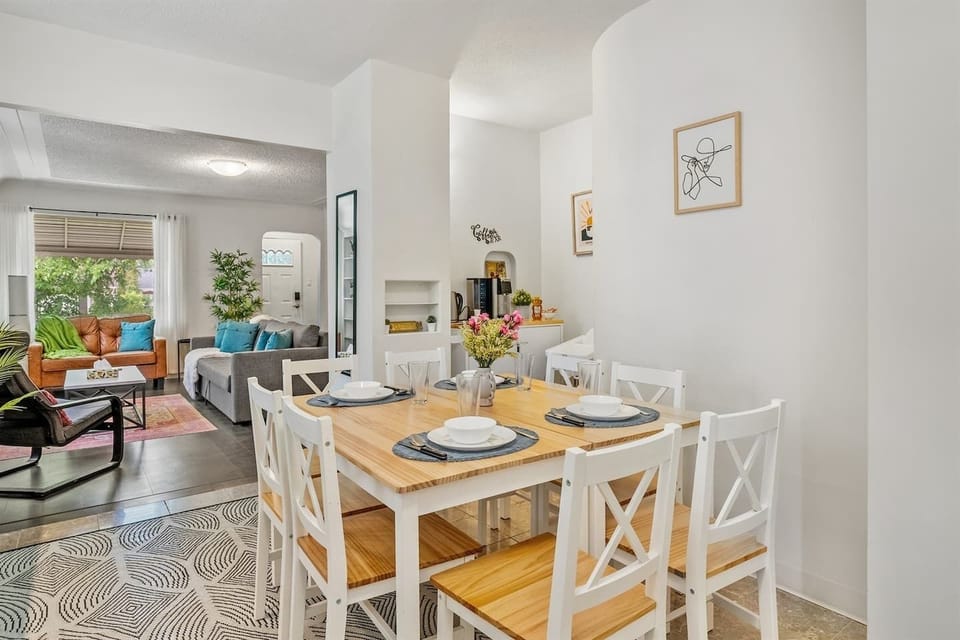 Gather around the stylish dining table that comfortably seats six perfect for shared meals, games, and quality time in a bright and welcoming space.