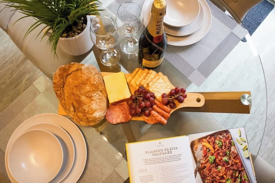 “Dining area by the garden view — enjoy your meals while soaking in the relaxing greenery right outside the door.”
