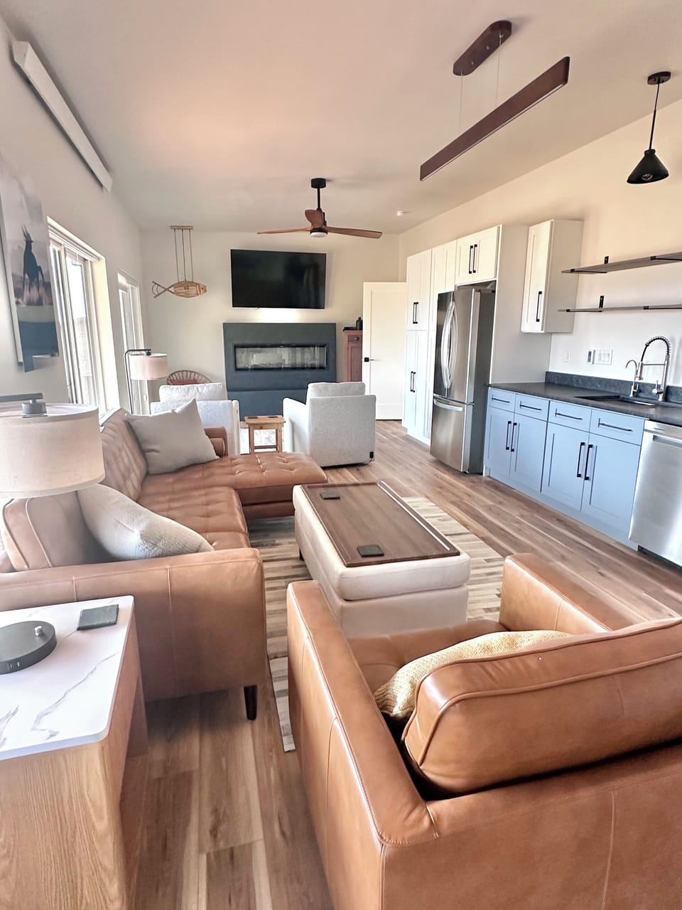 Open kitchen to couches, swivel, USB and reclining chairs, electric FP. Views!