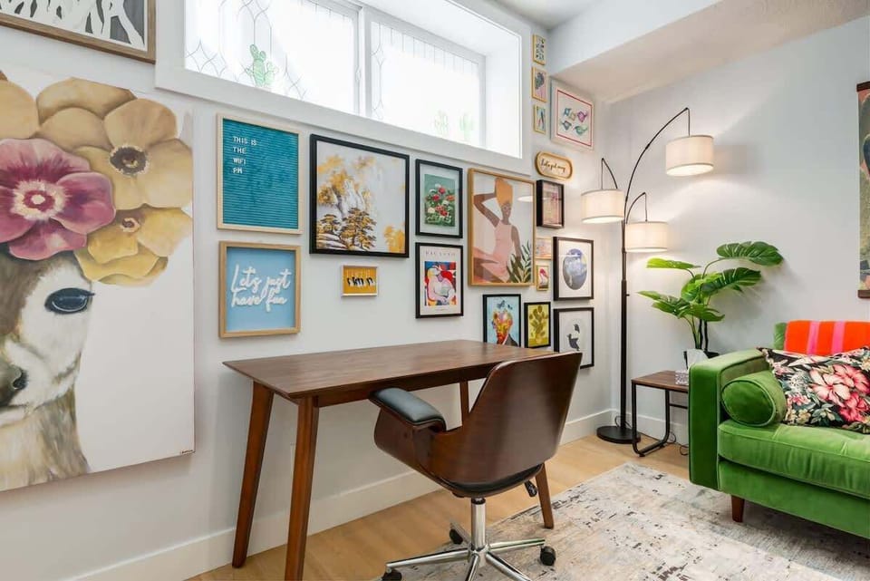Dedicated workspace surrounded by vibrant gallery walls
A creative, energizing corner designed for inspiration, productivity, or journaling over morning coffee.