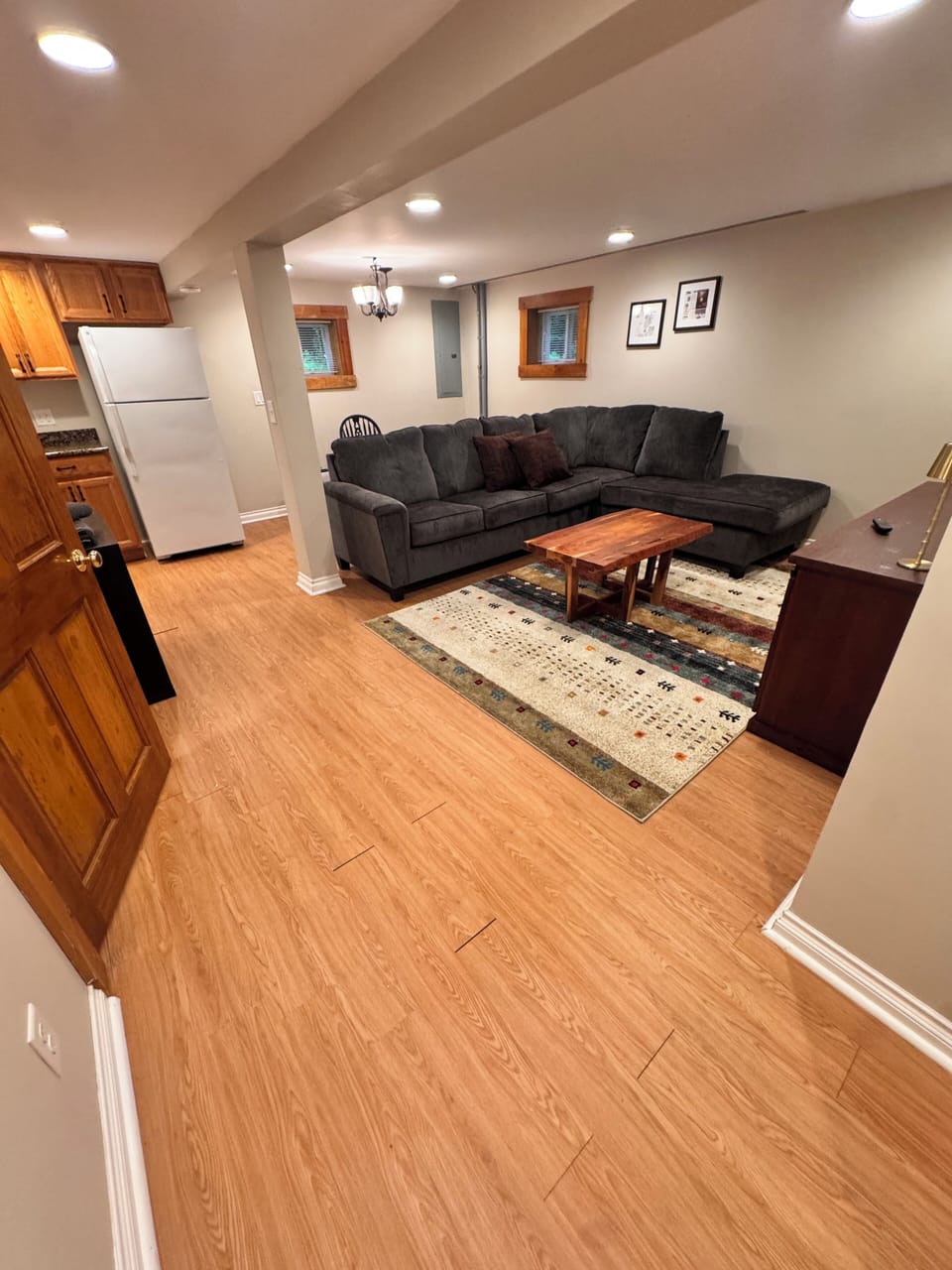 Lower level with refrigerator for extra food and beverage storage.