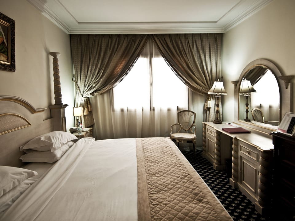 Suite, 1 King Bed, Smoking | Premium bedding, minibar, in-room safe, desk