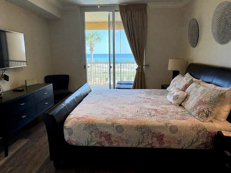 Master bedroom with own ceiling to floor gulf views and balcony access