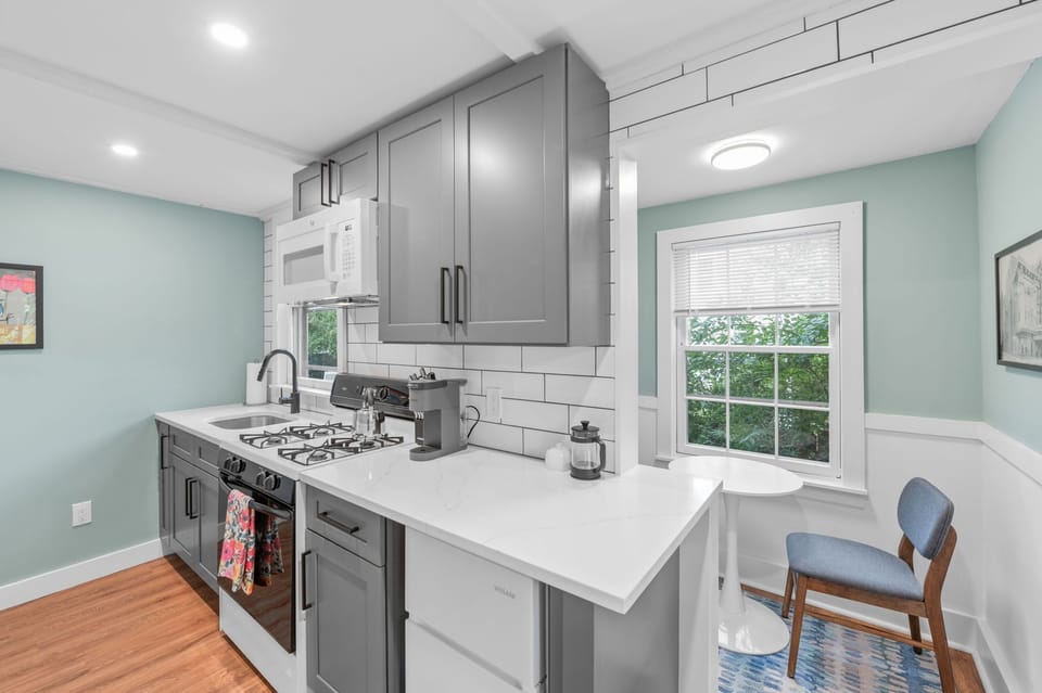 Enjoy the cozy breakfast nook by the window just behind the kitchen.
