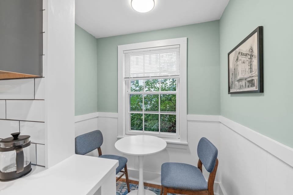 Dine and relax by the window at our cozy round table!