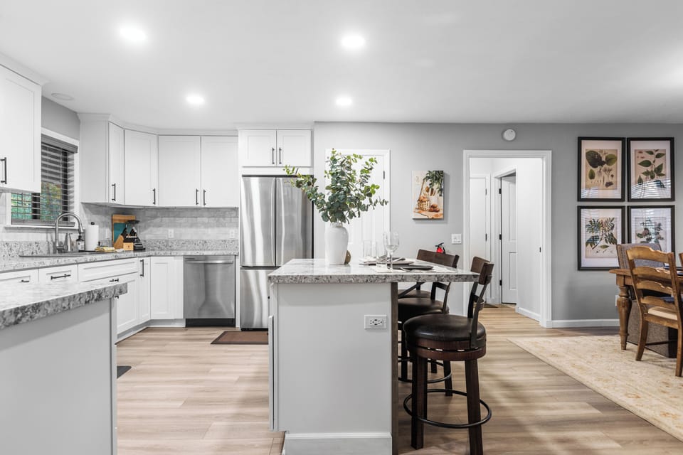 Kitchen with island and bar seating.