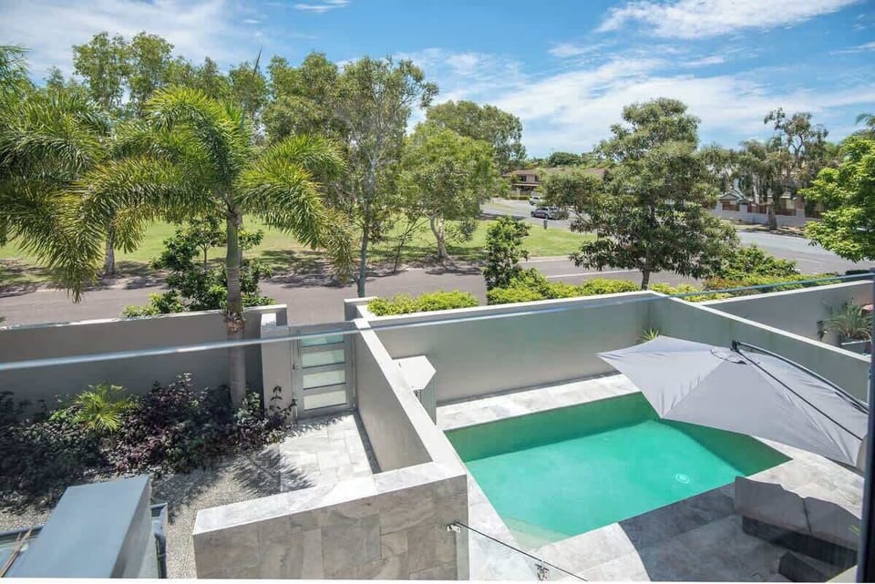 The view from the upstairs balcony over your private pool. 
