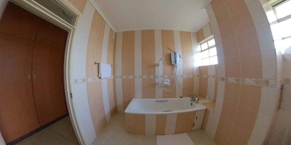 Deluxe Double Room, City View | Bathroom | Shower, slippers, towels, soap