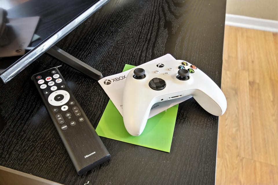 Smart TV with streaming + gaming console.