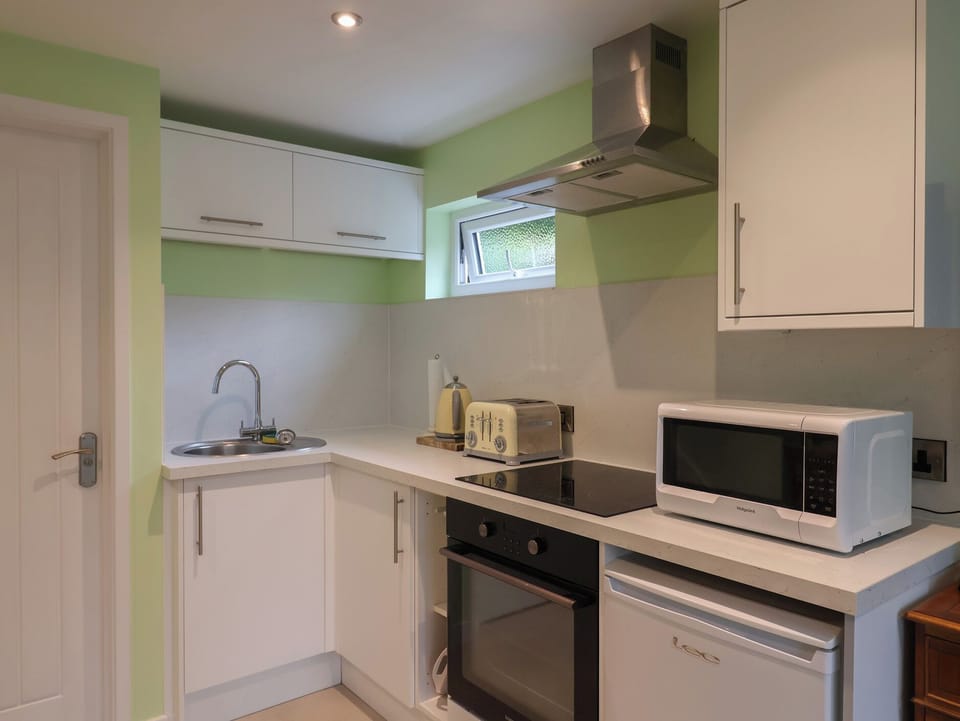Fridge, microwave, cookware/dishes/utensils
