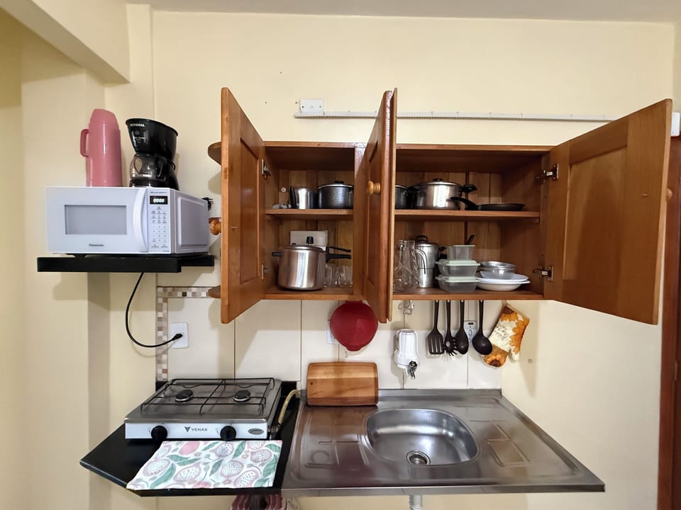 City Apartment | Private kitchen | Full-size fridge, microwave, coffee/tea maker, cookware/dishes/utensils