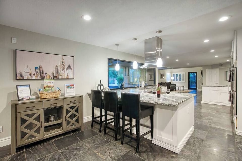 Chef’s kitchen with pro appliances & island seating.