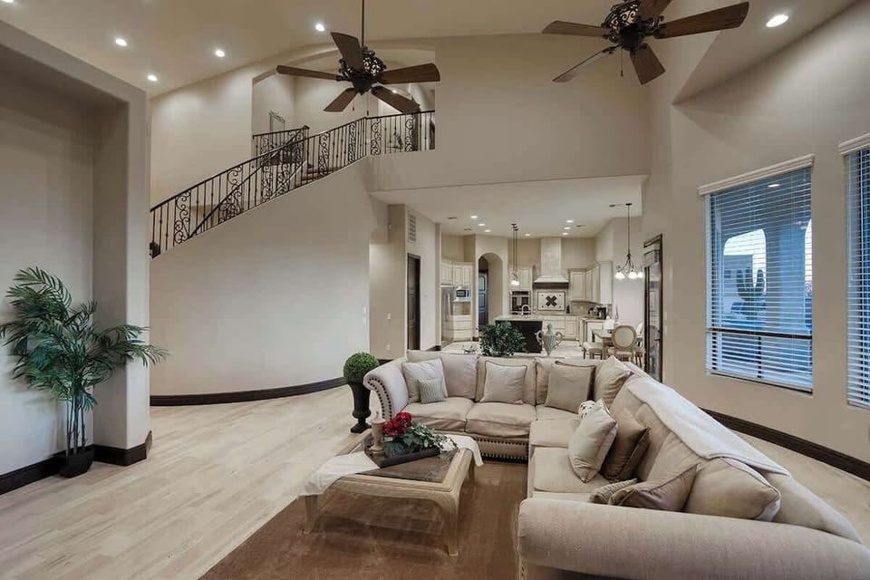 Open-concept living area with plush seating and smart TV